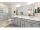 Double vanity bathroom with large mirror and shower at 6027 Towering Oaks Dr, Charlotte, NC 28205