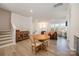 Light and bright dining area adjacent to the living room and kitchen at 6027 Towering Oaks Dr, Charlotte, NC 28205