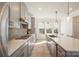 Modern kitchen with gray cabinets, white countertops, and stainless steel appliances at 6027 Towering Oaks Dr, Charlotte, NC 28205