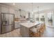 Modern kitchen with gray cabinets, white countertops, and stainless steel appliances at 6027 Towering Oaks Dr, Charlotte, NC 28205