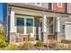 Inviting front porch with wicker chairs and landscaping at 6265 Six String Ct, Fort Mill, SC 29708