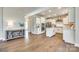 Modern kitchen with white cabinets, stainless steel appliances, and hardwood floors at 6265 Six String Ct, Fort Mill, SC 29708