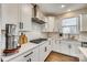 White kitchen with gas range and subway tile backsplash at 6265 Six String Ct, Fort Mill, SC 29708