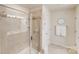 Bathroom with shower/tub combo, double vanity, and updated fixtures at 6417 Union Station Ct, Charlotte, NC 28210