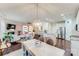 Open concept dining area with chandelier and seating for four at 6417 Union Station Ct, Charlotte, NC 28210