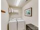 Convenient laundry room with washer, dryer, and shelving at 6417 Union Station Ct, Charlotte, NC 28210