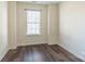 Simple bedroom with hardwood floors and window at 6808 Cascade Dream Ct # 118, Huntersville, NC 28078