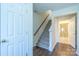 Bright entryway with staircase leading upstairs and view of a bathroom at 6808 Cascade Dream Ct # 118, Huntersville, NC 28078