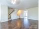 Spacious living room featuring hardwood floors and access to backyard at 6808 Cascade Dream Ct # 118, Huntersville, NC 28078