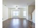 Spacious living room with hardwood floors and a large window at 6808 Cascade Dream Ct # 118, Huntersville, NC 28078