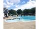 Community pool with plenty of lounge chairs at 6808 Cascade Dream Ct # 118, Huntersville, NC 28078