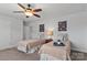 Spacious bedroom with two twin beds, nightstands, and modern wall art at 703 Marion Dr, Matthews, NC 28105