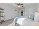 Spacious bedroom featuring a ceiling fan and access to another room at 703 Marion Dr, Matthews, NC 28105