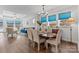 Bright dining room features hardwood floors and a charming wooden table with six chairs at 703 Marion Dr, Matthews, NC 28105