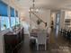 Elegant dining room adjacent to kitchen and staircase at 703 Marion Dr, Matthews, NC 28105