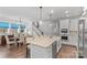 Modern kitchen with white cabinets, granite counters and island at 703 Marion Dr, Matthews, NC 28105