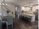 Modern kitchen with white cabinets and granite countertops at 703 Marion Dr, Matthews, NC 28105