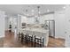 Modern kitchen with white cabinets, granite counters, and island at 703 Marion Dr, Matthews, NC 28105