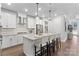 Modern kitchen with white cabinets, granite counters, and island at 703 Marion Dr, Matthews, NC 28105