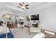 Living room with hardwood floors, fireplace, and view of the dining area at 703 Marion Dr, Matthews, NC 28105