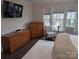 Main bedroom with hardwood floors and sitting area at 703 Marion Dr, Matthews, NC 28105