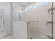 Spacious walk-in shower with glass enclosure and grab bar at 703 Marion Dr, Matthews, NC 28105