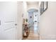 Bright entryway with wood-look floors and a slim console table at 7216 Somerford Rd, Charlotte, NC 28215