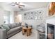 Cozy living room featuring a fireplace and comfortable seating at 7216 Somerford Rd, Charlotte, NC 28215