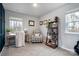 Functional home office with a desk, chair, and bookshelf at 7216 Somerford Rd, Charlotte, NC 28215