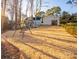 Large backyard with swing set and view of home at 7476 Point St, Denver, NC 28037