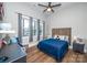 Cozy bedroom with wood accent wall and blue bedding at 7476 Point St, Denver, NC 28037