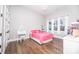 Charming bedroom with pink bedding and ample natural light at 7476 Point St, Denver, NC 28037