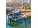 Private boat dock with covered slip and floating dock, perfect for lake access at 7476 Point St, Denver, NC 28037