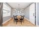 Charming dining room with a round wooden table and black chairs at 7476 Point St, Denver, NC 28037