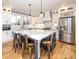 Modern kitchen with blue island, white cabinets and quartz countertops at 7476 Point St, Denver, NC 28037