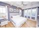 Main bedroom with light and bright decor and hardwood floors at 7476 Point St, Denver, NC 28037