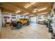 Bright workshop with a collection of Jeep parts and a lifted Jeep at 7476 Point St, Denver, NC 28037