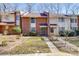 Brick front exterior of townhome with landscaping and walkway at 8465 Ramath Dr, Charlotte, NC 28211