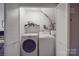 Convenient laundry room with washer and dryer in closet at 8465 Ramath Dr, Charlotte, NC 28211