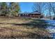 View of home from the backyard, with wooden fence at 940 Valley Dr, Newton, NC 28658