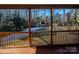 View of fenced backyard with patio and trees at 940 Valley Dr, Newton, NC 28658