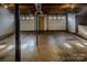 Unfinished basement with double garage doors at 940 Valley Dr, Newton, NC 28658