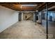 Unfinished basement with stairs, storage, and a punching bag at 940 Valley Dr, Newton, NC 28658