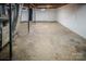 Unfinished basement with concrete floor and a punching bag at 940 Valley Dr, Newton, NC 28658