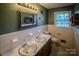 Bathroom with double vanity and a separate tub and shower at 940 Valley Dr, Newton, NC 28658