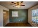 Bedroom with wood floors and green accent wall at 940 Valley Dr, Newton, NC 28658