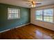 Bedroom with wood floors and large window at 940 Valley Dr, Newton, NC 28658