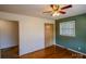 Bedroom with wood floors and green accent wall at 940 Valley Dr, Newton, NC 28658