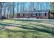 Brick ranch house with a spacious lawn and mature trees at 940 Valley Dr, Newton, NC 28658