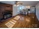 Kitchen with light wood cabinets, teal lower cabinets, and tile counters at 940 Valley Dr, Newton, NC 28658